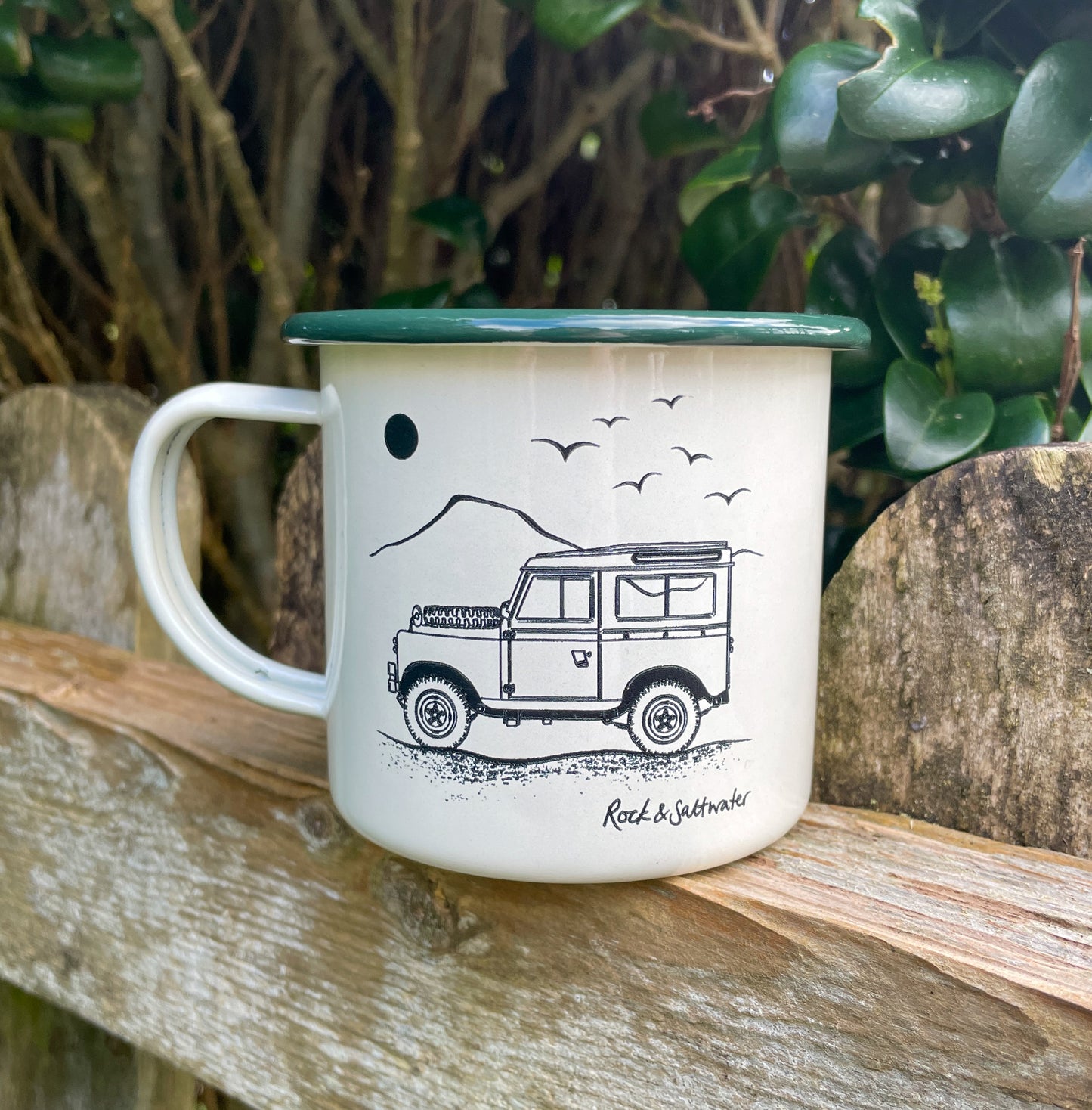 Land Rover side view with mountain enamel mug