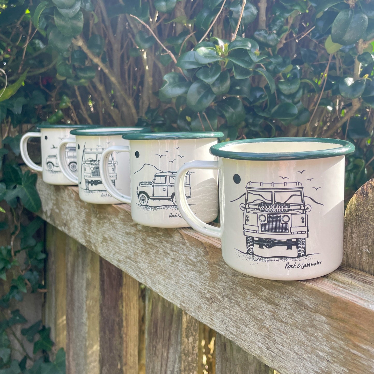 Land Rover side view with mountain enamel mug